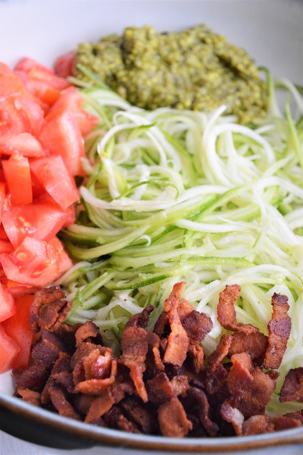 Pesto Zucchini Noodles with Bacon- Only 4 ingredients and 20 minutes to make a delicious zucchini noodle dish your whole family will love!