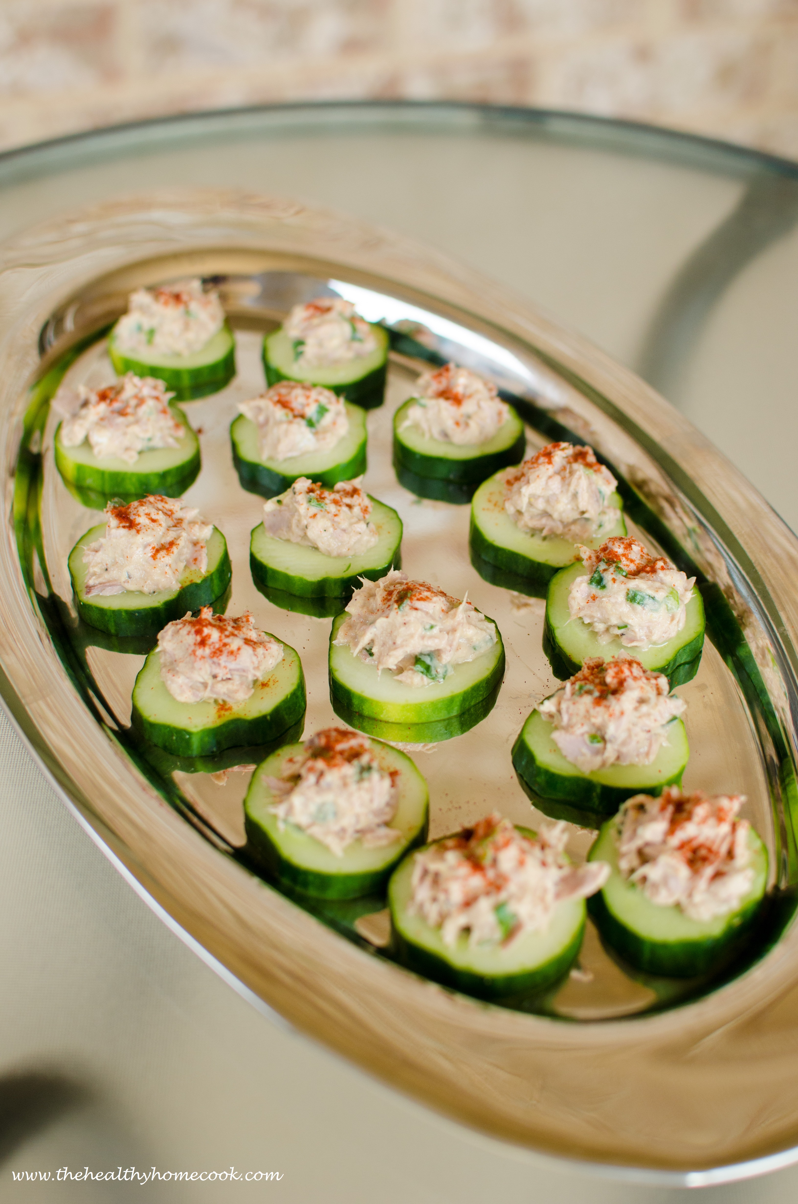 Cucumber Tuna Bites- An easy no cook appetizer that is light and refreshing. Plus, as a bonus...you don't have to worry about people double-dipping.