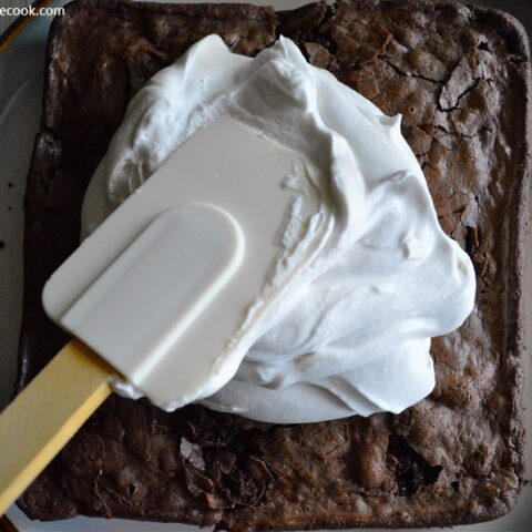 These gooey brownies with fluffy peppermint icing are the best way to celebrate Christmas.