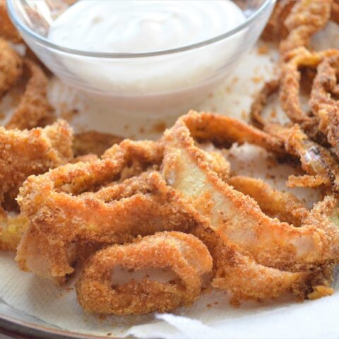 Crispy outside, tender inside, these homemade Crispy Baked Onion Rings are what dreams are made of!