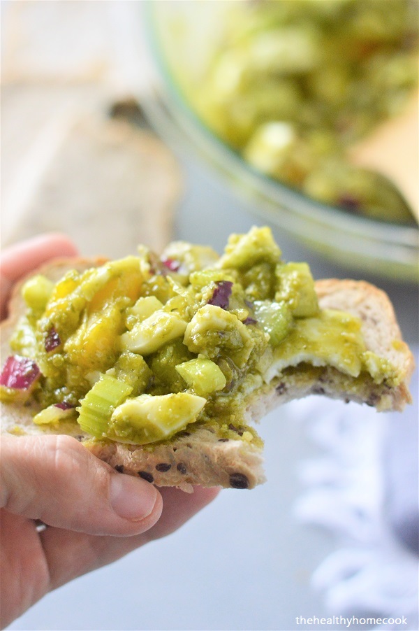 This crowd pleasing (mayo-free) Perfect Pesto Egg Salad will knock your socks off.  5 simple ingredients and you have a flavorful salad that is great any time of year.