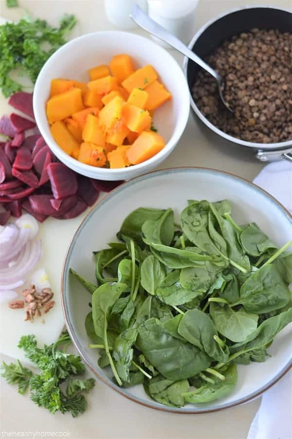 This delicious salad is loaded with tender butternut squash, fresh spinach, nutty lentils and finished with a honey dijon dressing. It's full of protein, easy to make, and so nourishing!