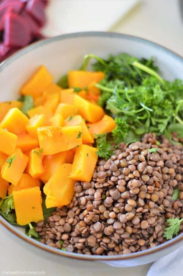This delicious salad is loaded with tender butternut squash, fresh spinach, nutty lentils and finished with a honey dijon dressing. It's full of protein, easy to make, and so nourishing!