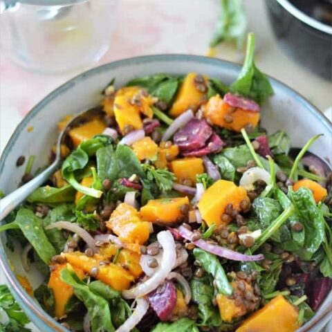 This delicious salad is loaded with tender butternut squash, fresh spinach, nutty lentils and finished with a honey dijon dressing. It's full of protein, easy to make, and so nourishing!