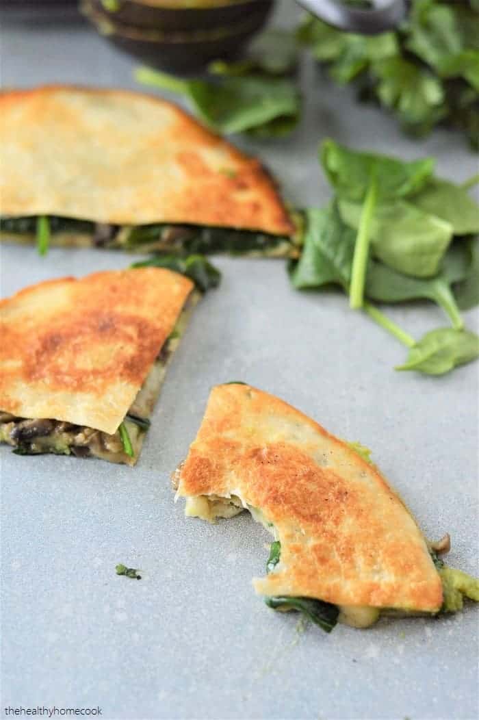 These vegetarian Sautéed Mushroom and Spinach Quesadillas are packed with so much flavor and perfectly seasoned.  Perfect for a quick weeknight meal!