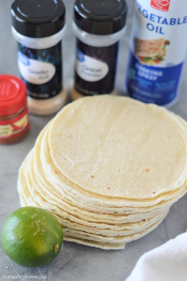These Homemade "Hint of Lime" Baked Tortilla Chips are easy, cheap and much lighter than the store bought version.