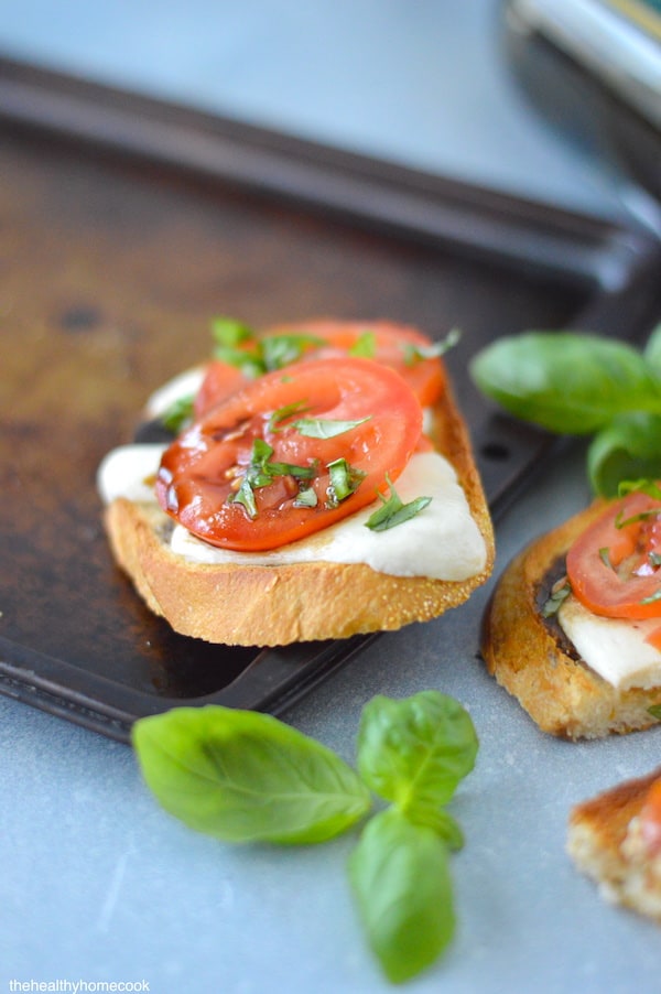 Grilled Caprese Toast. Charred rustic toast, topped with melted mozzarella, fresh tomatoes and a drizzle of balsamic. Perfect all year!