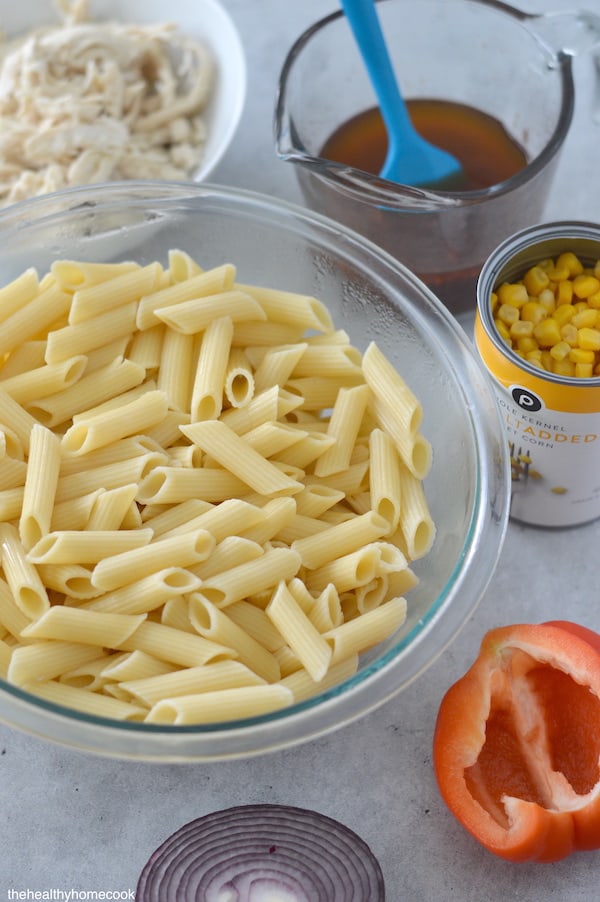 Overhead image of ingredients needed for pasta salad.