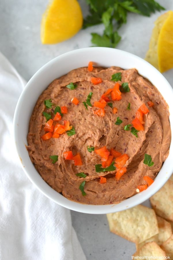 This Roasted Red Pepper Bean Dip is perfectly creamy, smoky, and just a little bit spicy!  This dip is so addicting!