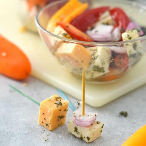 Give your charcuterie board an upgrade with these Marinated Cheese & Peppers. This appetizer is easy to make and full of flavor!