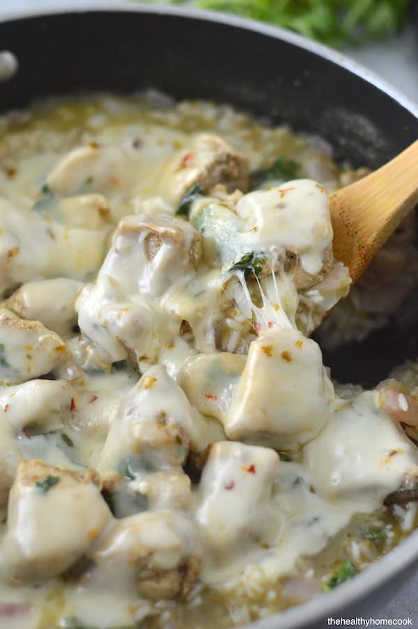 This Cheesy Salsa Verde Chicken & Rice Skillet is an easy one-pan meal, full of fresh ingredients and big flavor!