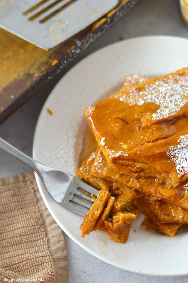 These Pumpkin Sheet Pan Pancakes are easy, soft and packed with flavor. They are the perfect breakfast treat on a fall morning.