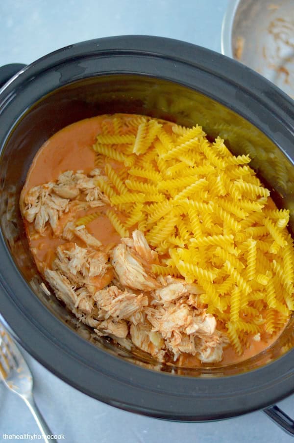 Indulge in the creamy goodness of this Slow Cooker Creamy Tomato Chicken & Pasta recipe. A comfort food recipe the whole family loves.