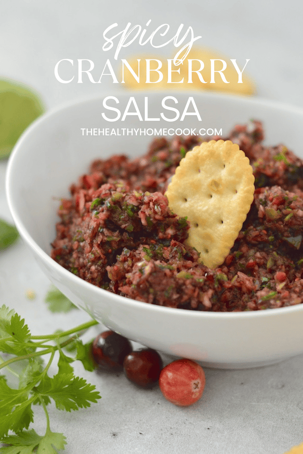 This Spicy Cranberry Salsa is easy to make and full of holiday flavor! Save this recipe for a crowd-pleasing dip.