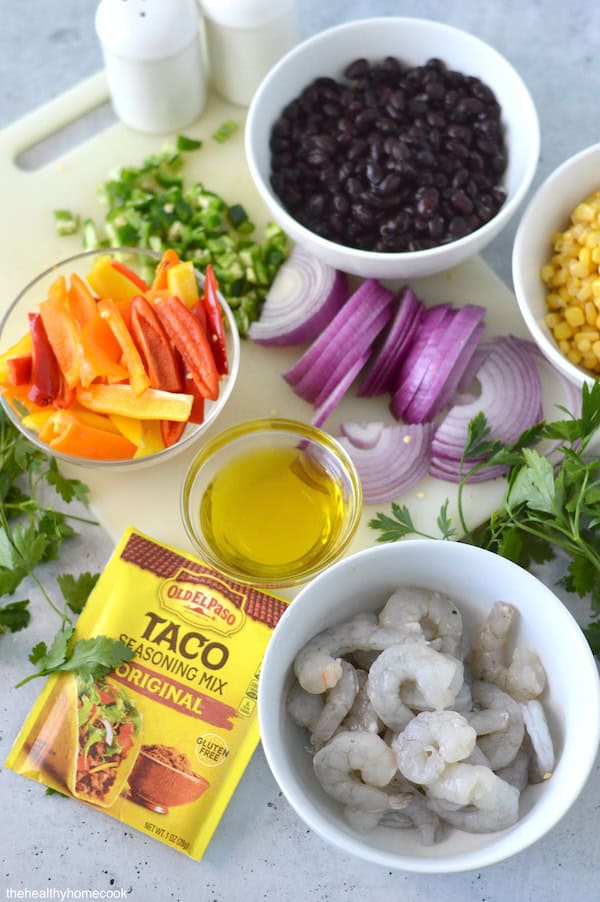 This easy Shrimp Taco Bowl with beans, veggies and spices is the ultimate weeknight family dinner—no mess, no stress!