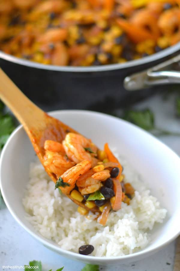 This easy Shrimp Taco Bowl with beans, veggies and spices is the ultimate weeknight family dinner—no mess, no stress!