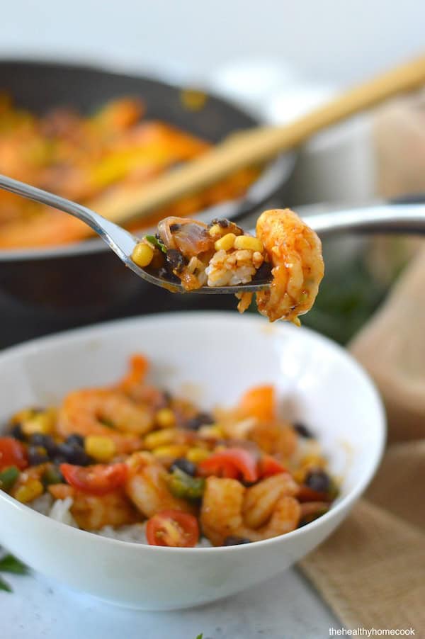 This easy Shrimp Taco Bowl with beans, veggies and spices is the ultimate weeknight family dinner—no mess, no stress!