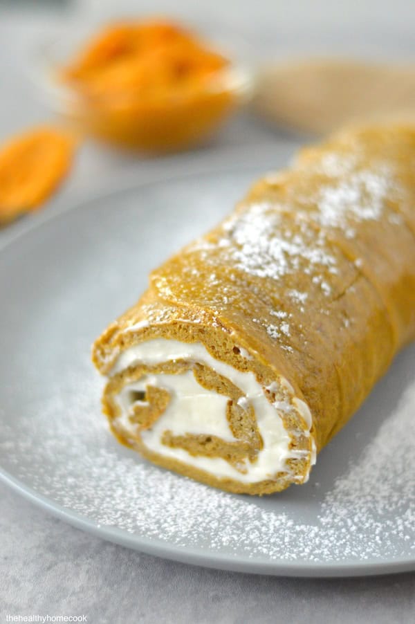 This Gluten Free Pumpkin Roll cake is soft, fluffy, and full of warm fall flavor. It's the perfect fall treat!