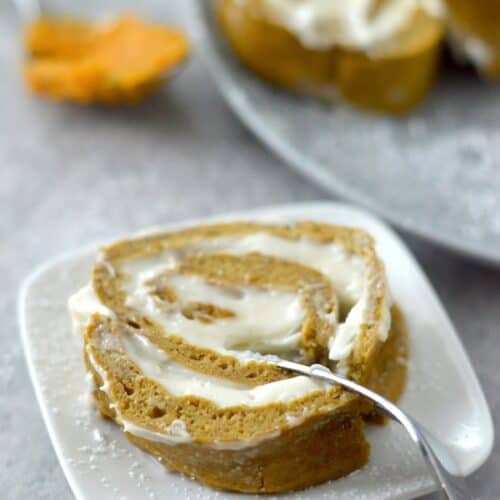 This Gluten Free Pumpkin Roll cake is soft, fluffy, and full of warm fall flavor. It's the perfect fall treat!