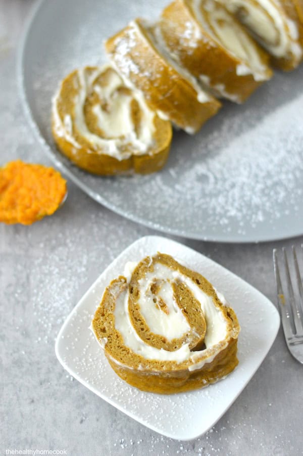 This Gluten Free Pumpkin Roll cake is soft, fluffy, and full of warm fall flavor. It's the perfect fall treat!