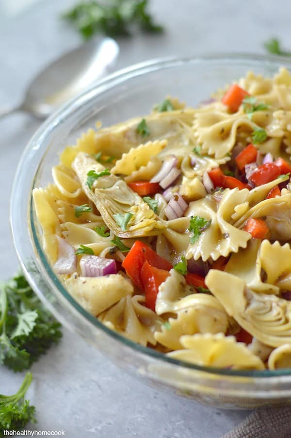This Artichoke Pasta Salad is simple to toss together, super flavorful, and healthy too. The perfect quick fix salad!