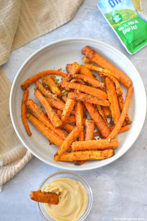 These Air Fryer Carrot Fries are about to become your new favorite healthy side dish!  Topped with Parmesan cheese and seasoned to perfection!