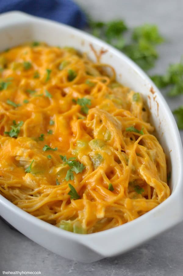 Creamy, cheesy, packed with flavor and PROTEIN — this lightened up Chicken Spaghetti is comfort food with a nutritious twist.