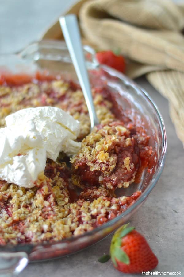 This Easy Strawberry Crisp can be made with fresh or frozen strawberries and is topped with a delicious oatmeal coconut oil crumble.