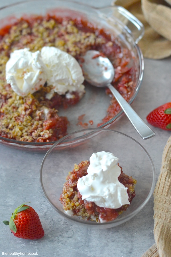 This Easy Strawberry Crisp can be made with fresh or frozen strawberries and is topped with a delicious oatmeal coconut oil crumble.