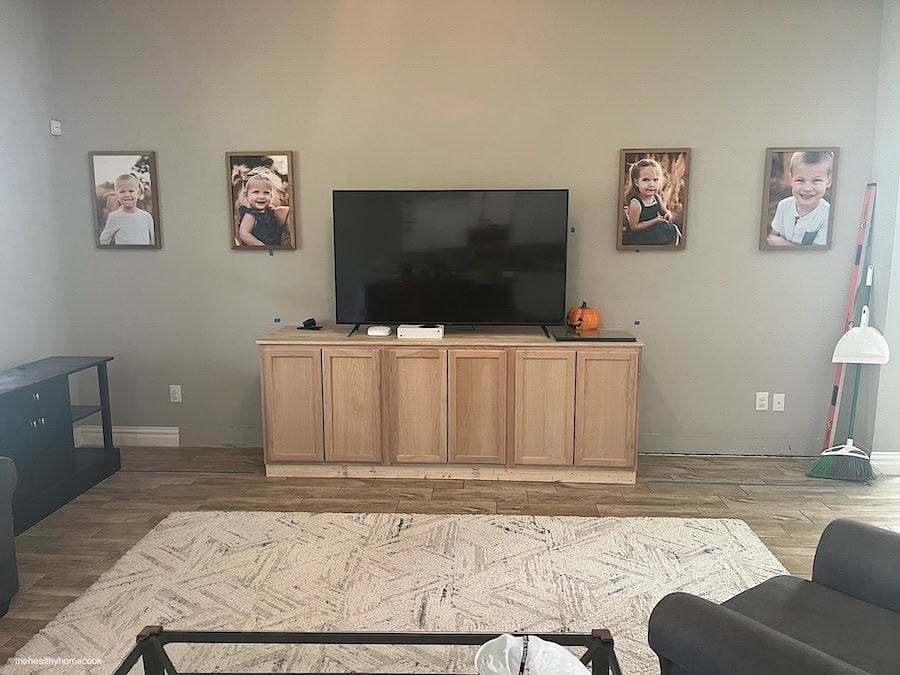 Process images of blank wall with 3 stock cabinets in the middle.