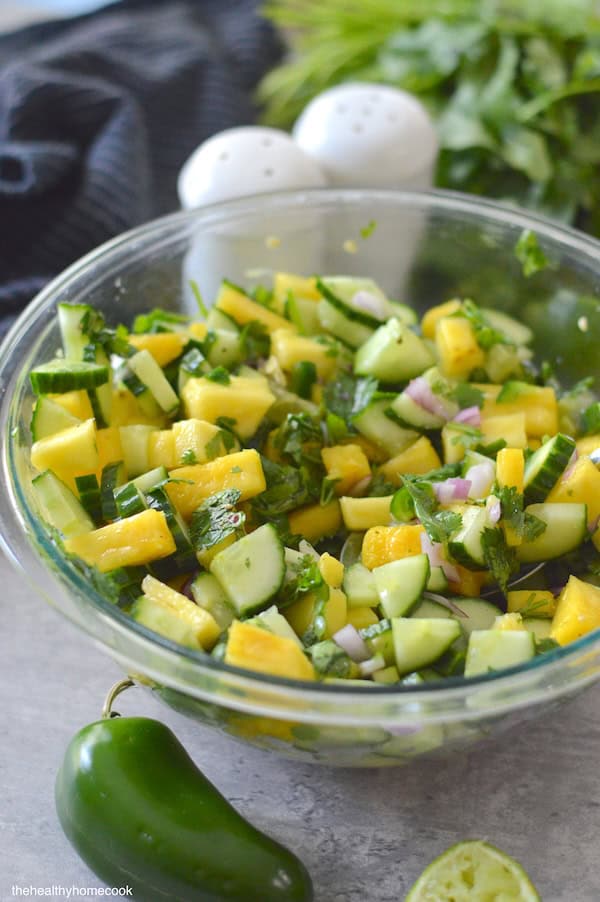 Final image of Spicy Cucumber Pineapple Salad in serving bowl.